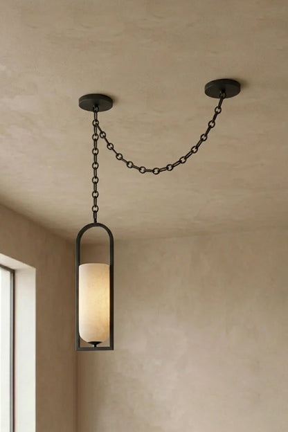 Cressida Alabaster Melange Chain Chandelier hanging from the ceiling in an upscale modern interior.