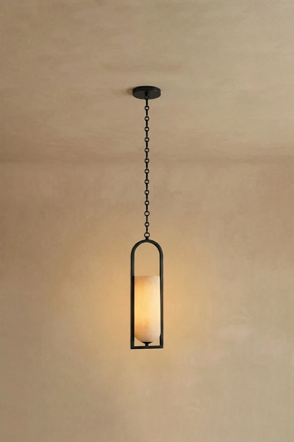 Cressida Alabaster Melange Chain Chandelier hanging from the ceiling in an upscale modern interior.