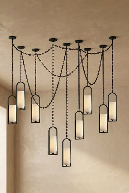 Cressida Alabaster Melange Chain Chandelier hanging from the ceiling in an upscale modern interior.