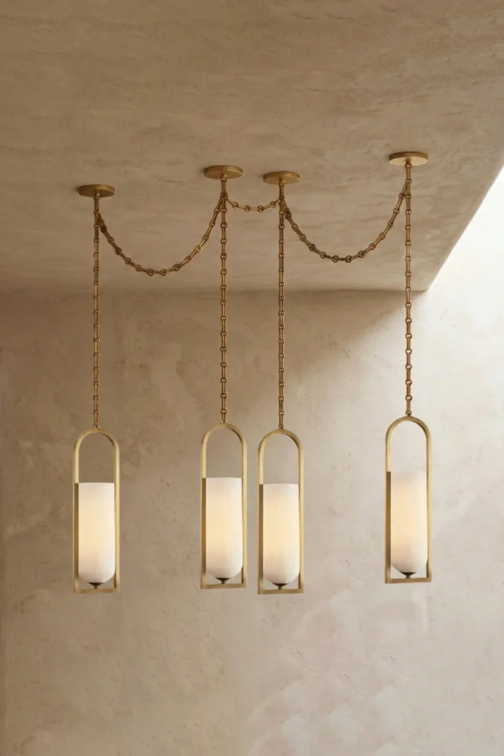 Cressida Alabaster Melange Chain Chandelier hanging from the ceiling in an upscale modern interior.