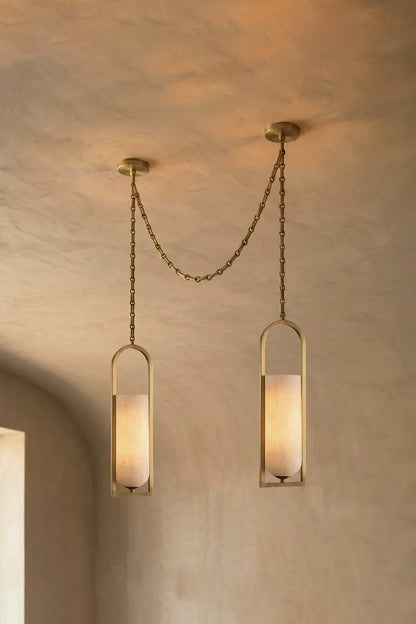 Cressida Alabaster Melange Chain Chandelier hanging from the ceiling in an upscale modern interior.