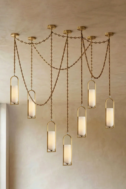 Cressida Alabaster Melange Chain Chandelier hanging from the ceiling in an upscale modern interior.