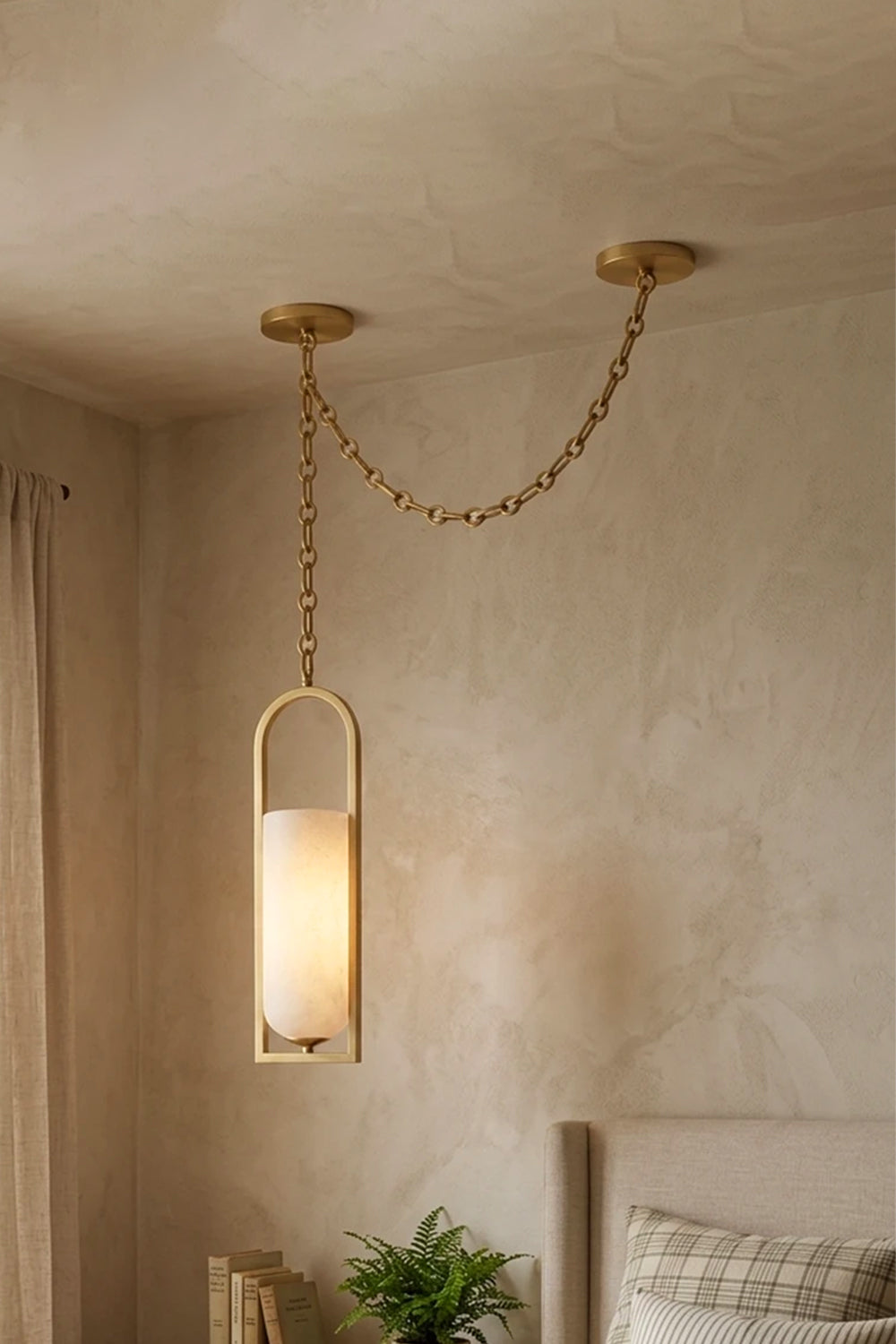 Cressida Alabaster Melange Chain Chandelier hanging from the ceiling in an upscale modern interior.