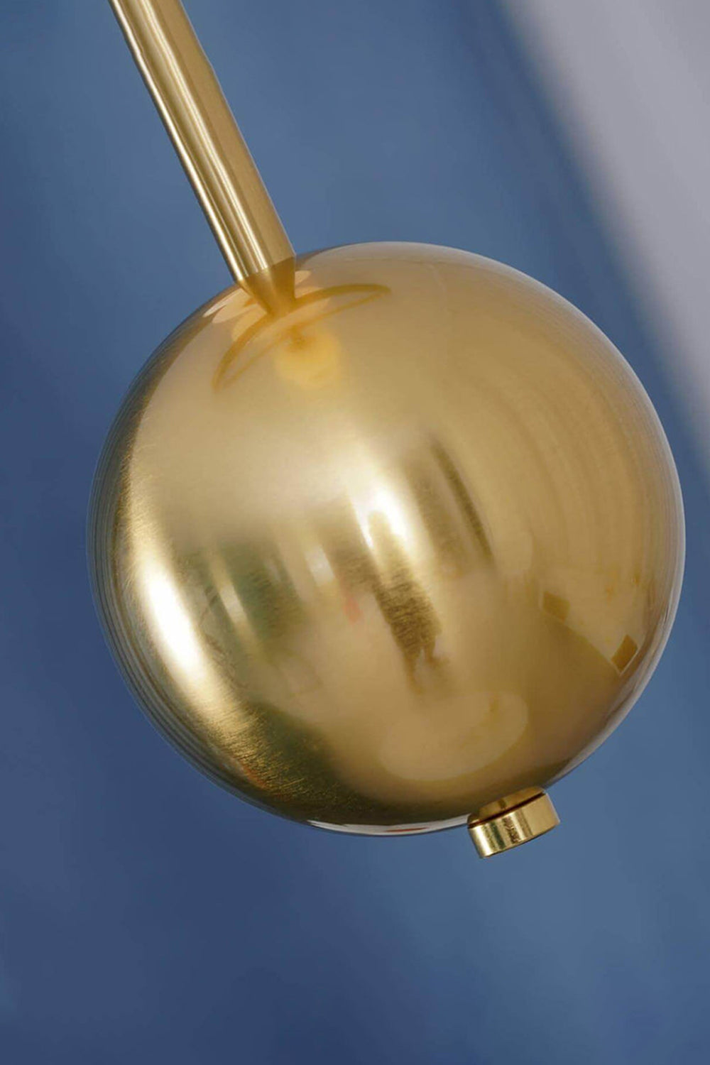 Delphine Pearl Strand Chandelier with a polished gold globe detail, showcasing elegant lighting design.