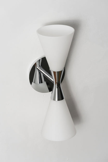 Diabolo Symmetry Glass Wall Sconce showcasing dual conical glass shades mounted on a sleek chrome fixture.