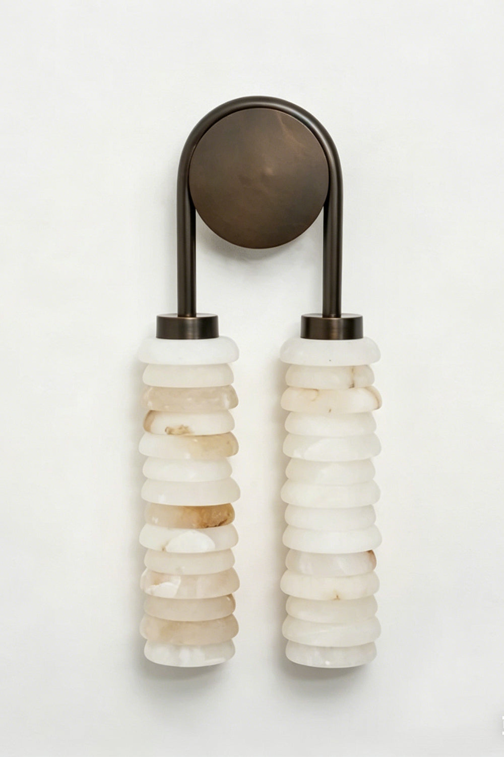 Dual Strata Alabaster Wall Lamp | Metal, Alabaster | Lit perspective view against a dark textured background, highlighting the glowing stone texture | vexa lamps