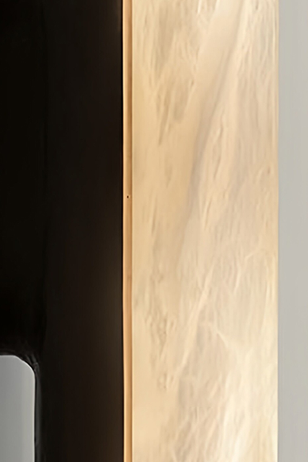 Elara Capsule Alabaster Wall Sconce close-up of alabaster and matte black design details.