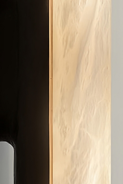 Elara Capsule Alabaster Wall Sconce close-up of alabaster and matte black design details.