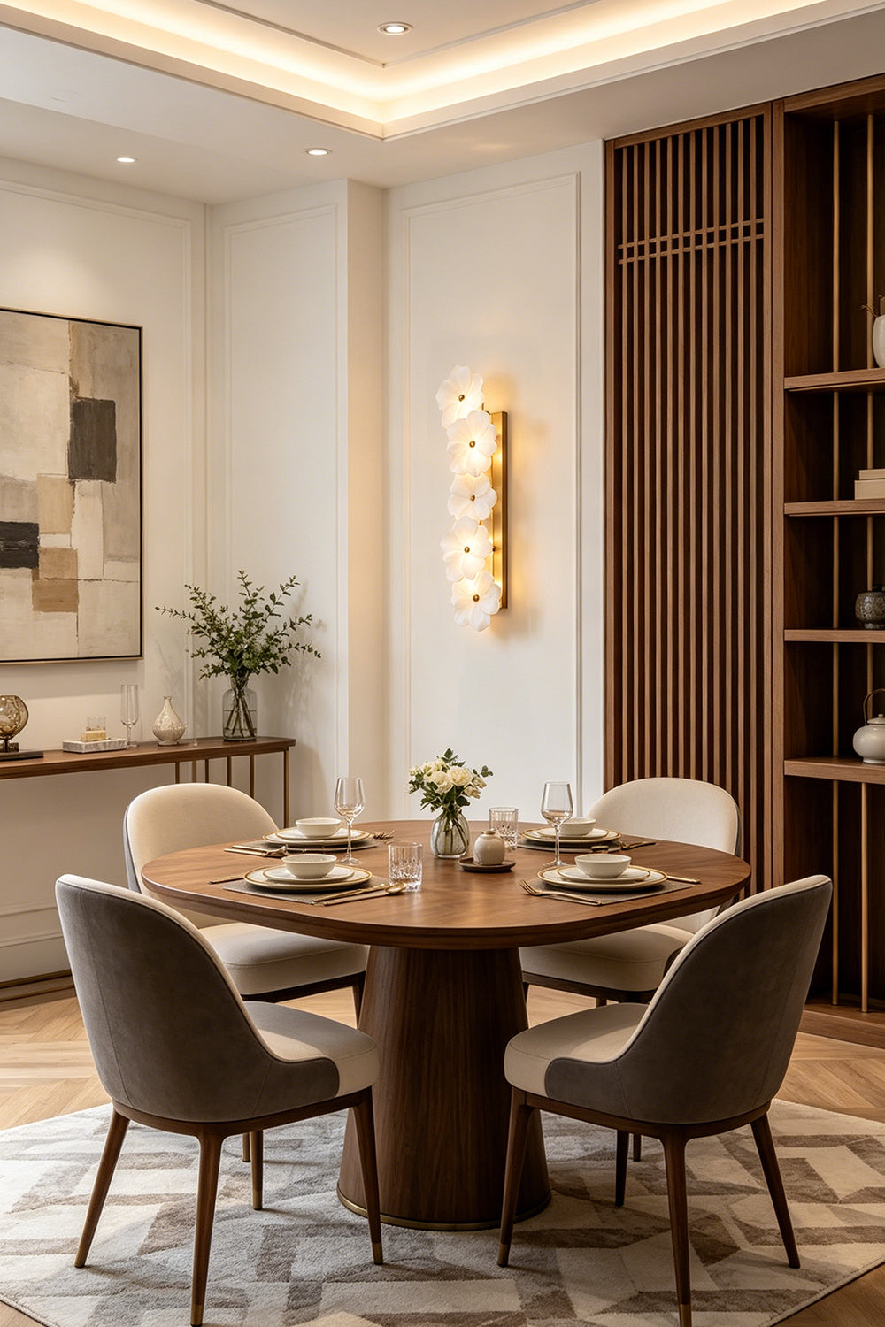 Elowen Alabaster Blossom Wall Light | Dining Room Decor | Radiating a soft ambient glow on a white wall in a refined dining room setup with a round wooden table and chairs | vexa lamps