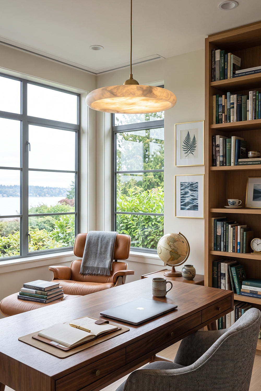 Elowen Alabaster Disc Pendant Light | Natural Alabaster and Brass | Styled in a contemporary home office library workspace over a dark wood desk and leather chair | vexa lamps