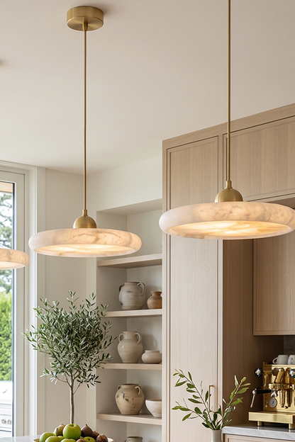 Elowen Alabaster Disc Pendant Light| Natural Alabaster and Brass | Multiple pendants lined up nicely to provide perfect illumination over a modern home kitchen bar area | vexa lamps