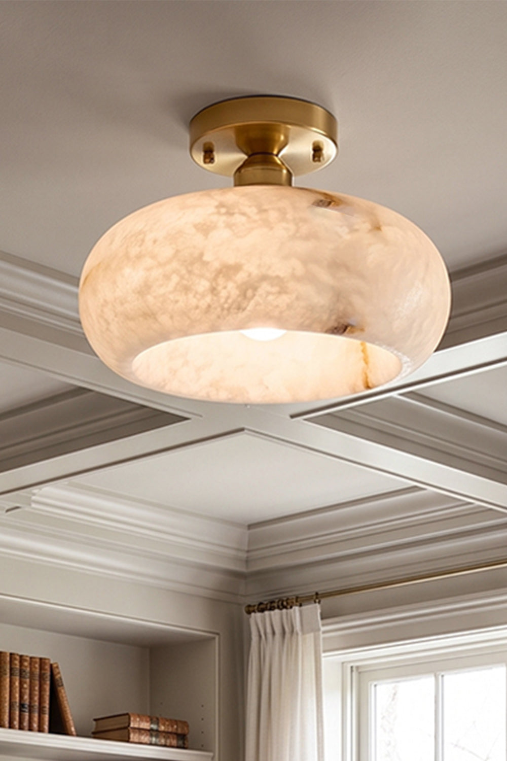 Elowen Alabaster Semi-Flush Ceiling Light featuring a natural alabaster dome and gold metal ceiling plate in a stylish interior.