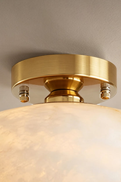 Elowen Alabaster Semi-Flush Ceiling Light showcasing the elegant brass ceiling plate and alabaster dome design.