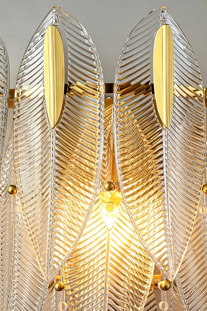 Elowen Cascading Glass Wall Lamp | Glass, Metal | Macro close-up view highlighting the glowing ribbed texture and feathery edges of the lit clear glass panels | Detail shot | vexa lamps