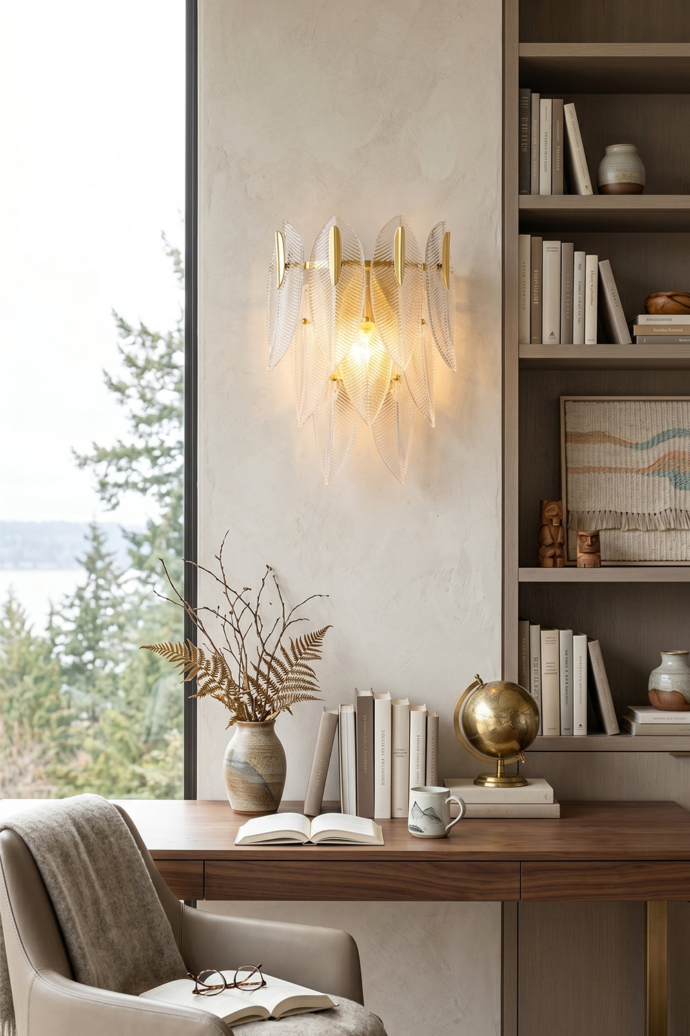 Elowen Cascading Glass Wall Lamp | Glass, Metal | Illuminating a minimalist contemporary study room, mounted above a wooden executive writing desk next to a bookcase | vexa lamps