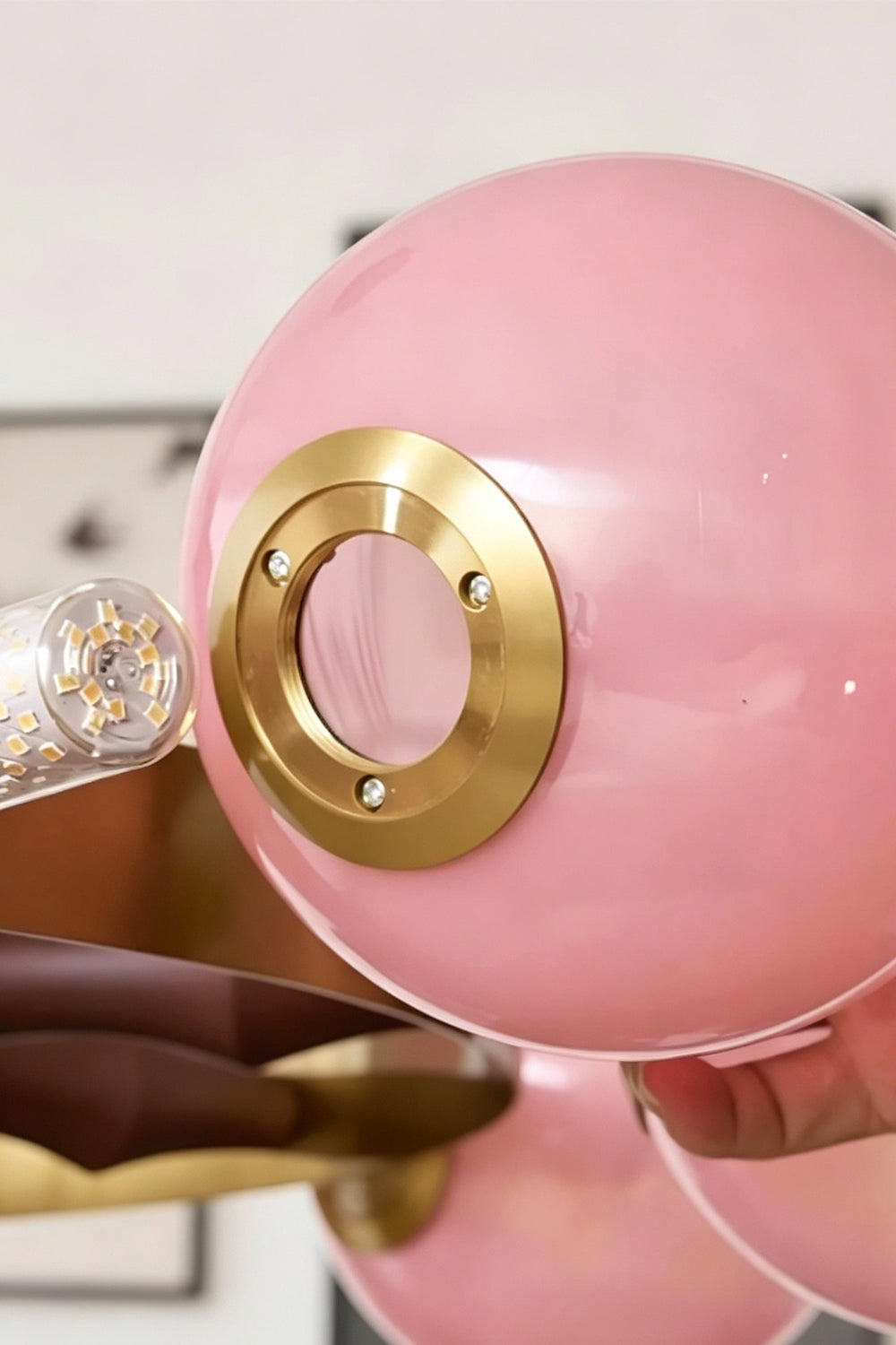 Detail of the pink glass globe and brass fitting | Glass, Metal | Showing the glossy pink finish and mounting ring | vexa lamps