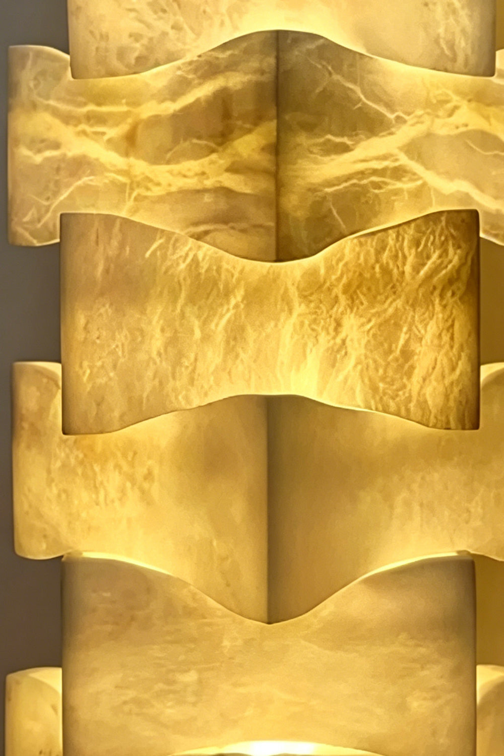 Ethereal Monolith lamp detail | Extreme close-up of stacked blocks | Intricate marble-like veining highlighted by warm internal light | Alabaster texture | Product detail | vexa lamps