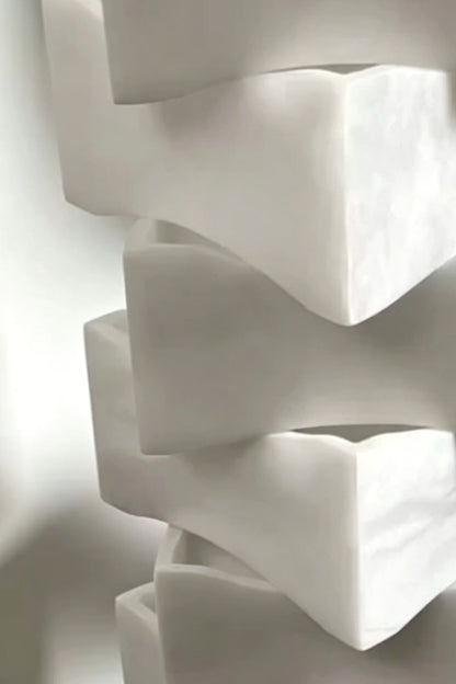 Ethereal Monolith lamp structure | Detailed close-up of interlinking block joints | Complex, puzzle-like stacked assembly | Alabaster stone finish | Product detail | vexa lamps