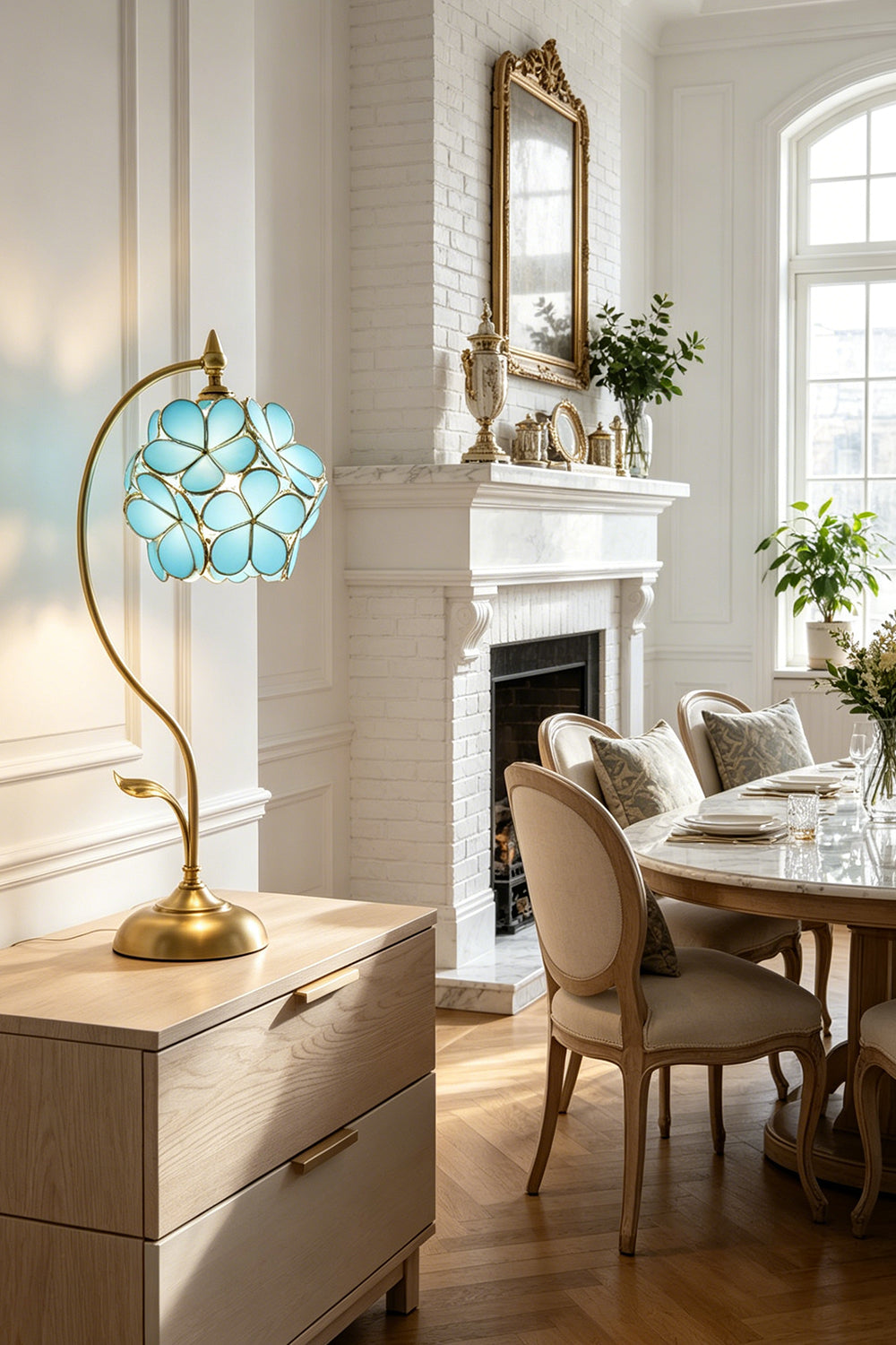Evanthe Blossom Stained Glass Table Lamp | Stained Glass, Metal | Blue glass flower table light casting a warm inviting glow on a white credenza cabinet in a traditional classical dining room | vexa lamps