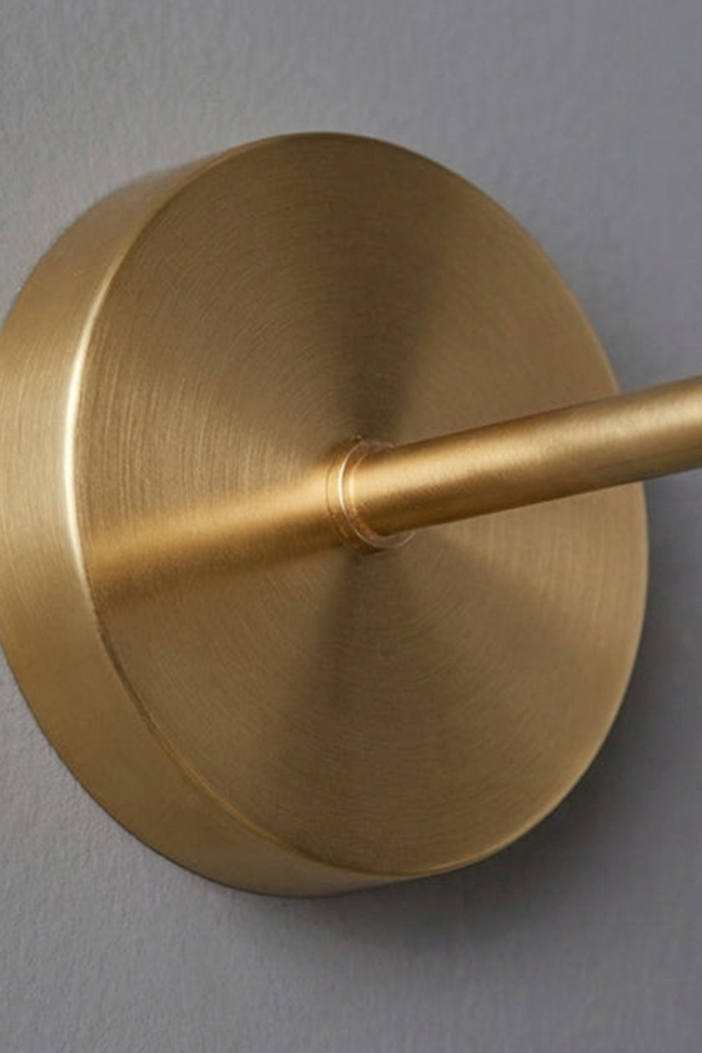 Everett Alabaster Hook-Arm Wall Sconce brass-toned backplate and arm detail