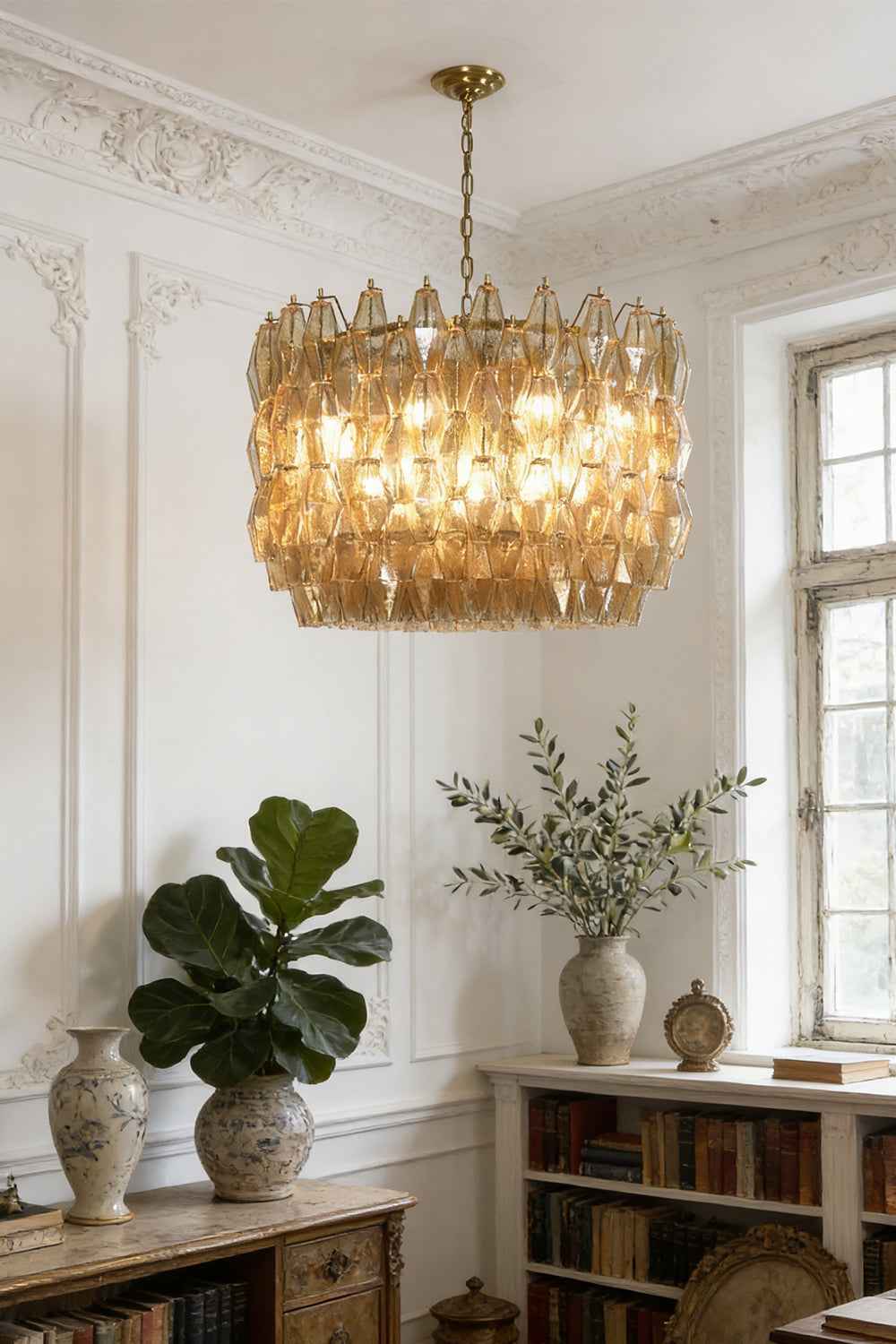 Faceted amber glass chandelier for library | Metal, Glass | Installed in a study with bookshelves and indoor plants | vexa lamps