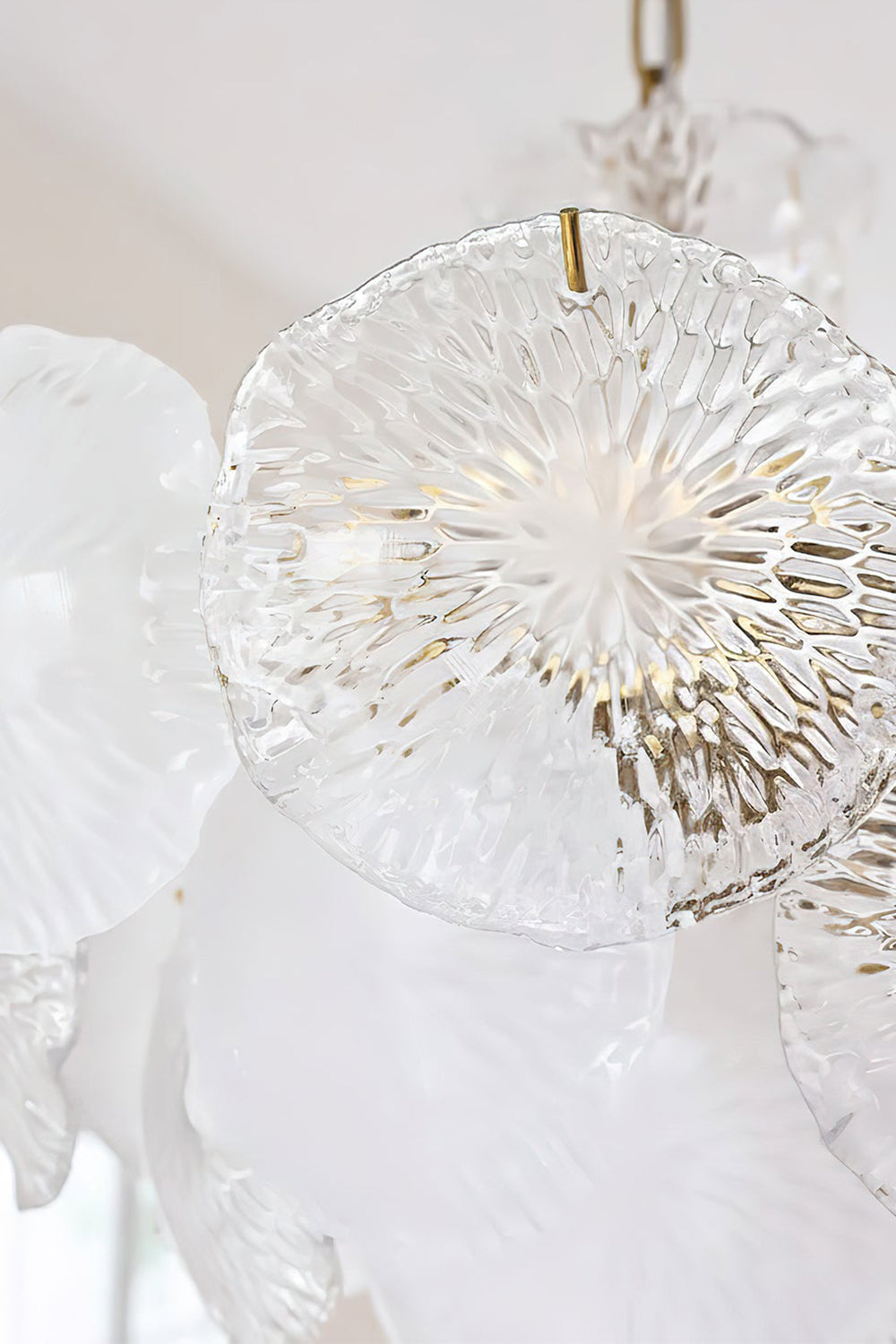 Close-up of the Fiore Radiance Glass Disc Chandelier showcasing elegant hand-finished glass discs.