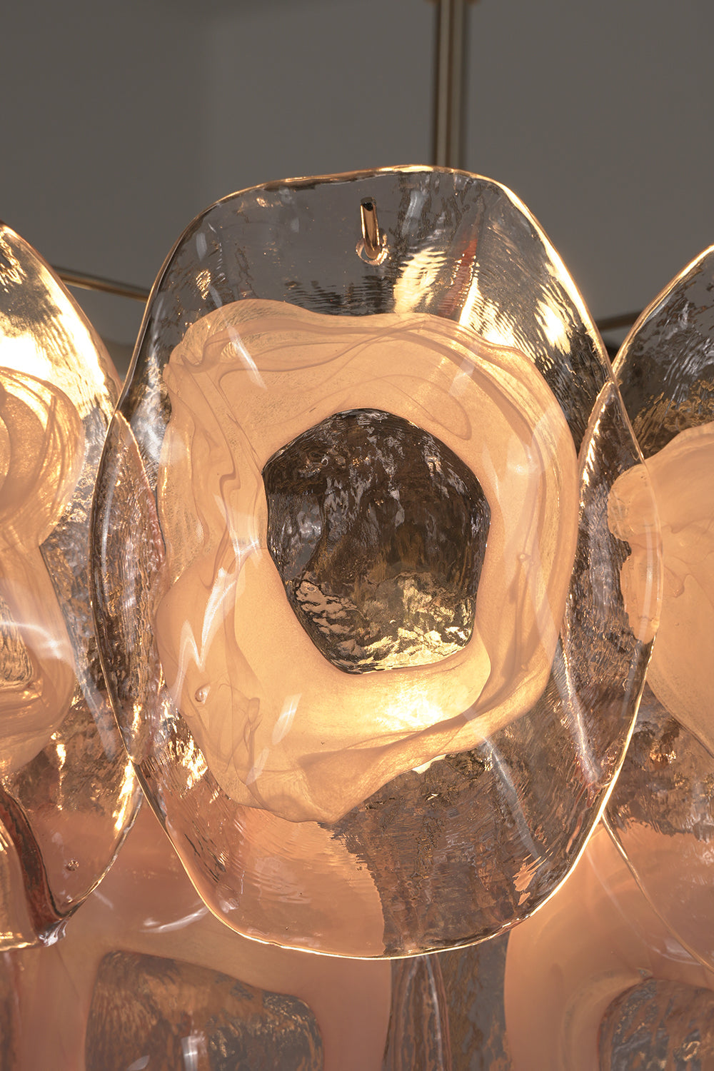 Frostelle pink glass texture | Glass | Close-up view of the glowing glass disc edges | vexa lamps