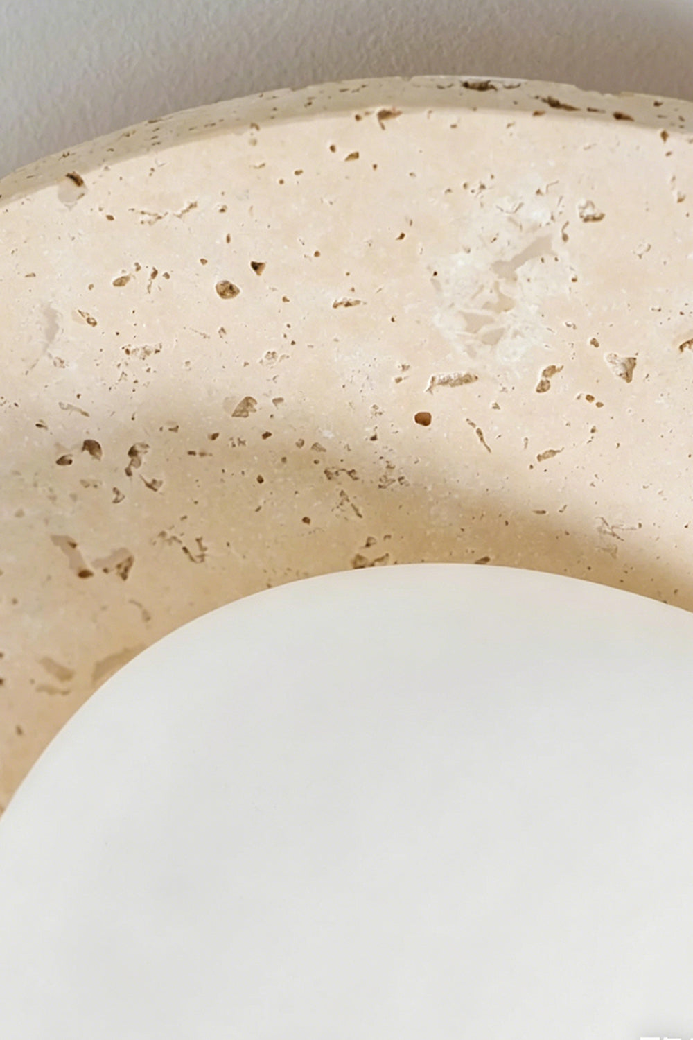 Travertine Ceiling Light Detail | Travertine | Macro shot of porous unlit stone texture | Detailed voids and natural pits | vexa lamps