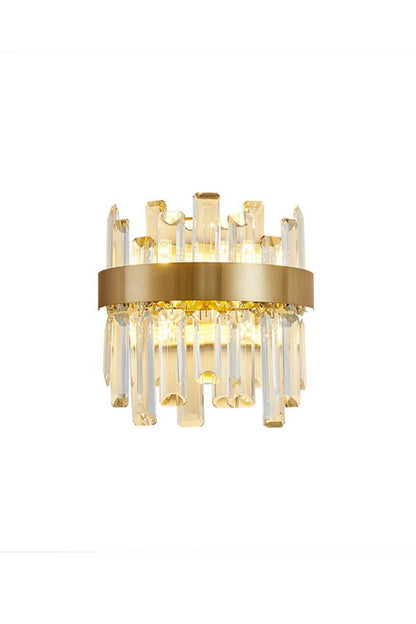 Glacia Tiered Crystal Statement Wall Lamp | Crystal, Metal | Fully illuminated luxury modern wall sconce featuring two tiers of clear crystal glass prisms encircled by a thick brushed gold brass band | Isolated product shot on white background | vexa lamps