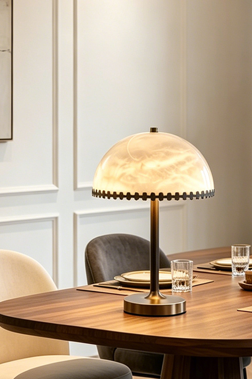 Helena Alabaster Trim Table Lamp | Cozy Dinner Lighting | Detailed view of the illuminated dome stone table lamp casting a warm yellow halo on a dark wood dining table | vexa lamps