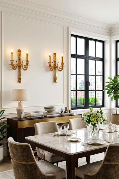 Honoria Rope and Tassel Brass Sconce | Brass and Metal | A pair mounted on a white paneled wall above a dark dining room cabinet | vexa lamps