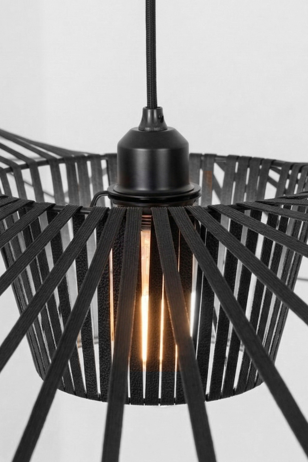 Lit hat-shaped pendant with warm bulb | Metal | Polyurethane elastic cloth | Glass fiber | Close-up of the internal cage and warm glow | vexa lamps