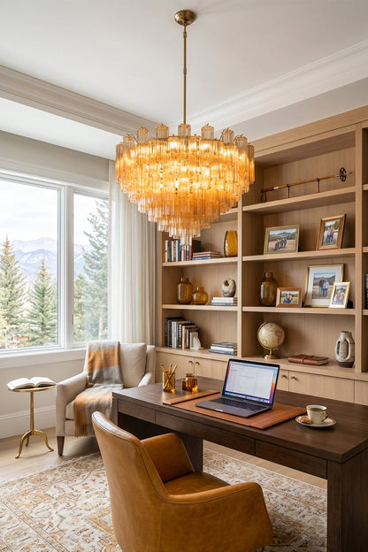 Isadora Tiered Amber Glass Chandelier illuminating a stylish home office with warm light and elegant decor.