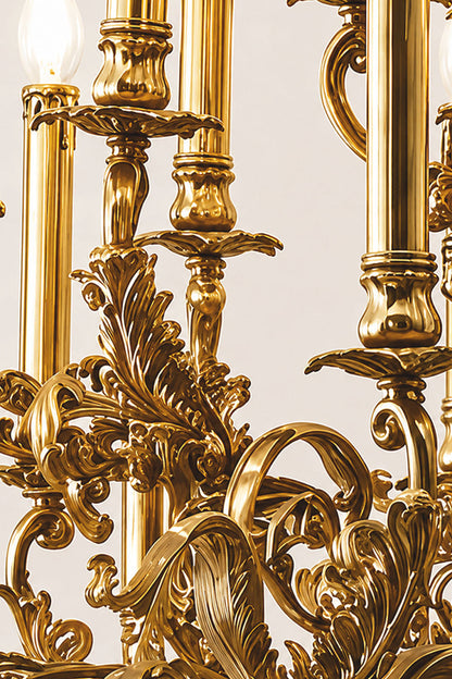 Close-up of the ornate details on the Percival Grand Brass Candelabra Chandelier, featuring intricate leaf designs.