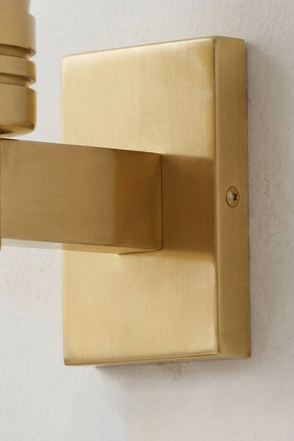 Isolde Alabaster Orb Wall Sconce | Natural Alabaster and Aged Brass | Side perspective close-up of the square rectangular metal backplate against a white wall | vexa lamps