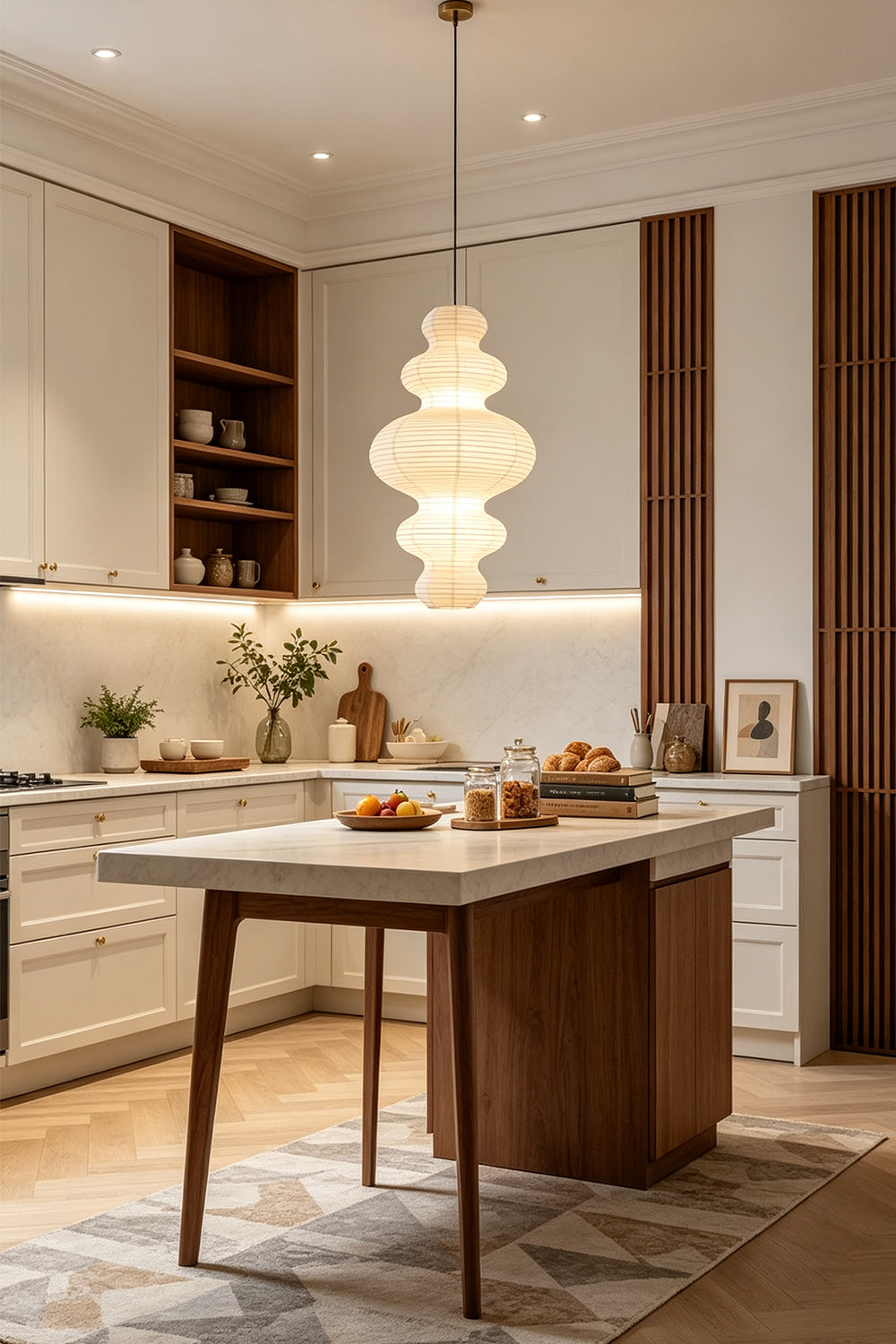 Isolde Stacked Paper Pendant Lamp | Textured Ribbed Paper | Suspended over a contemporary kitchen island with wooden bar stools and white cabinets | vexa lamps