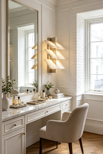 Isolde Tiered Alabaster Slab Wall Sconce illuminating a stylish vanity in a modern interior.