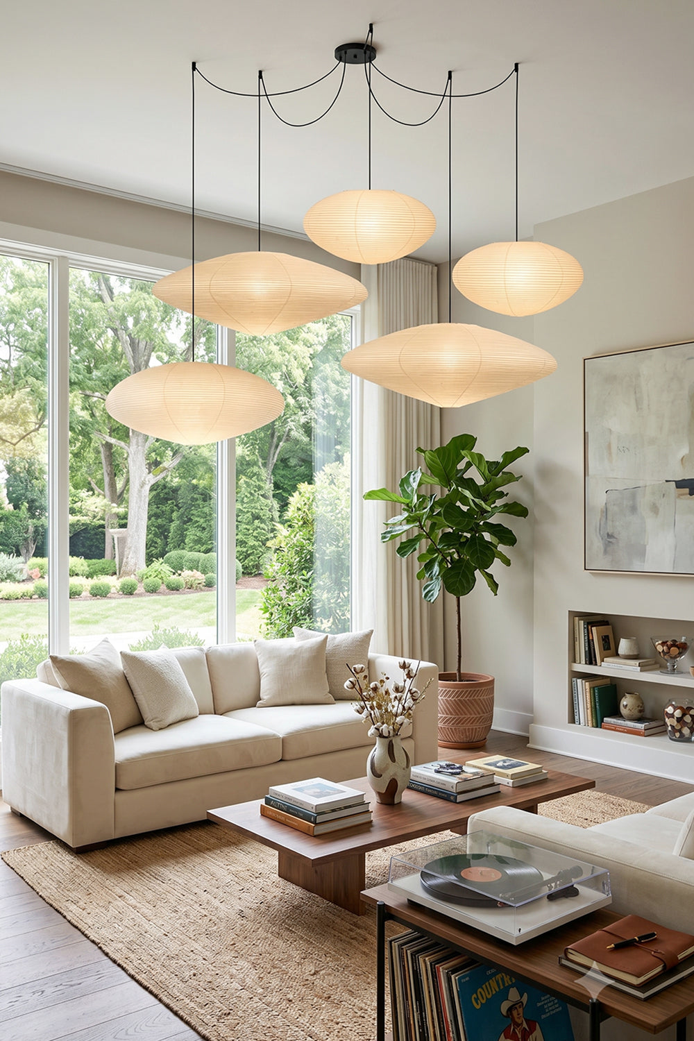 Komorebi Mulberry Paper Pendant Light | Paper, Bamboo | A cascading cluster of four paper pendants enhancing a serene minimalist Japandi living room with a cream sofa | vexa lamps