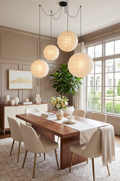 Komorebi Mulberry Paper Pendant Light | Paper, Bamboo | A dramatic cluster of three large paper lantern shades illuminating a sophisticated farmhouse-style dining area | vexa lamps
