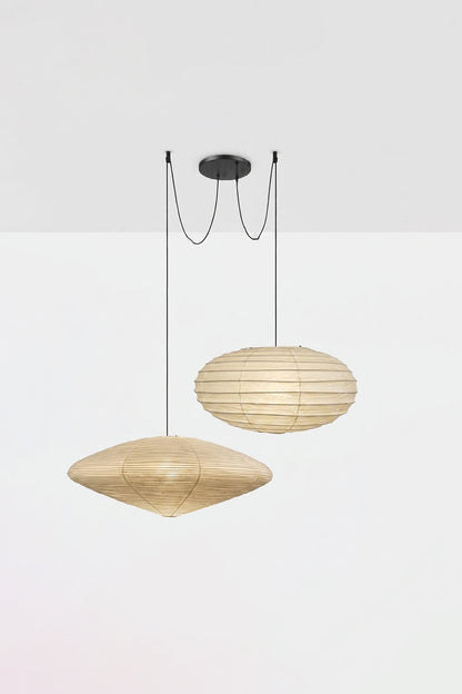 Komorebi Mulberry Paper Pendant Light | Paper, Bamboo | Studio view of a lit 3-light combination variant with two flat saucer shades and one sphere casting a warm glow | vexa lamps