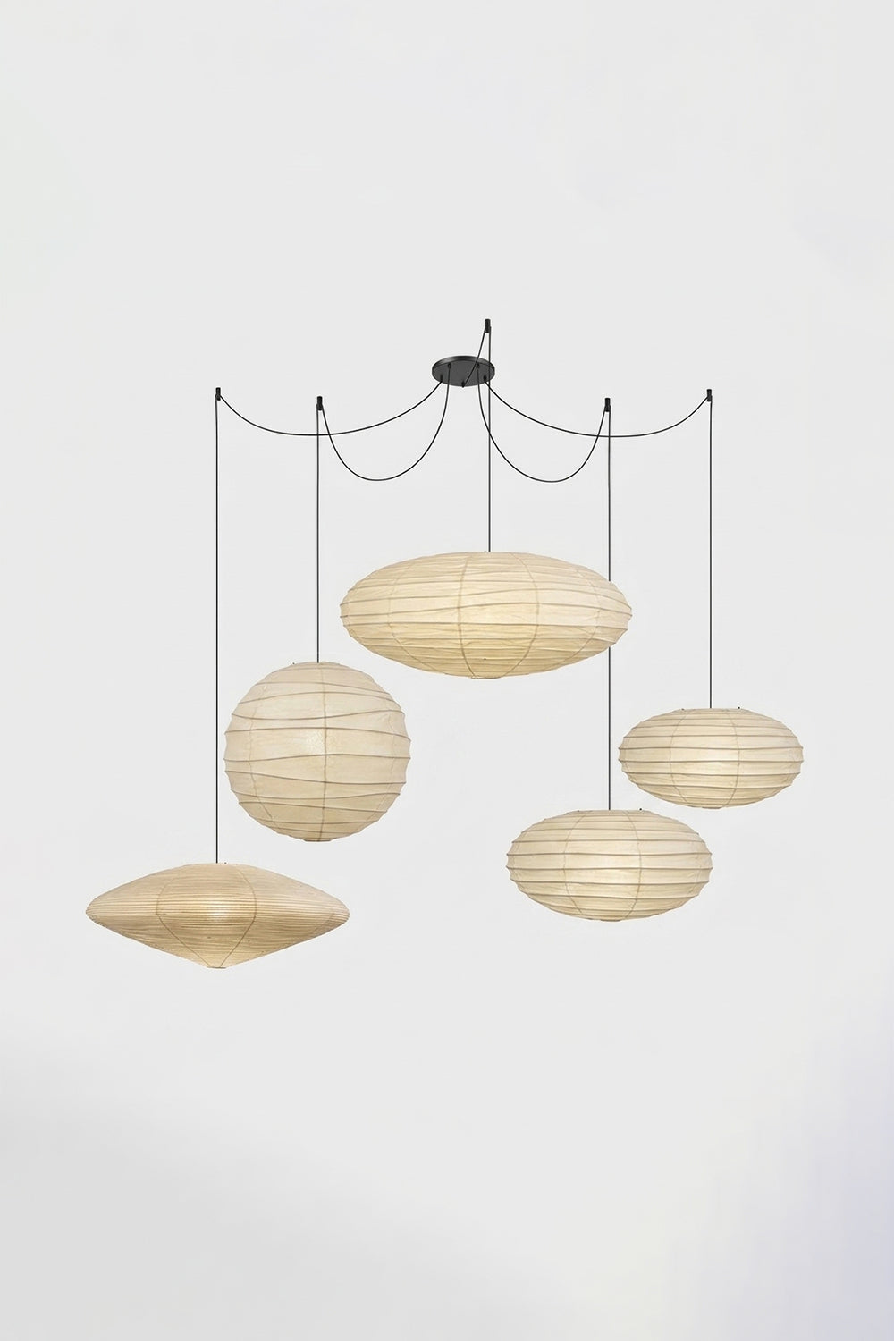 Komorebi Mulberry Paper Pendant Light | Paper, Bamboo | Studio view of a multi-cord 5-light unlit paper pendant cluster configuration hung from a central black canopy | vexa lamps