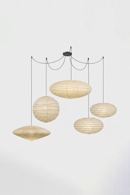 Komorebi Mulberry Paper Pendant Light | Paper, Bamboo | Studio view of a multi-cord 5-light unlit paper pendant cluster configuration hung from a central black canopy | vexa lamps