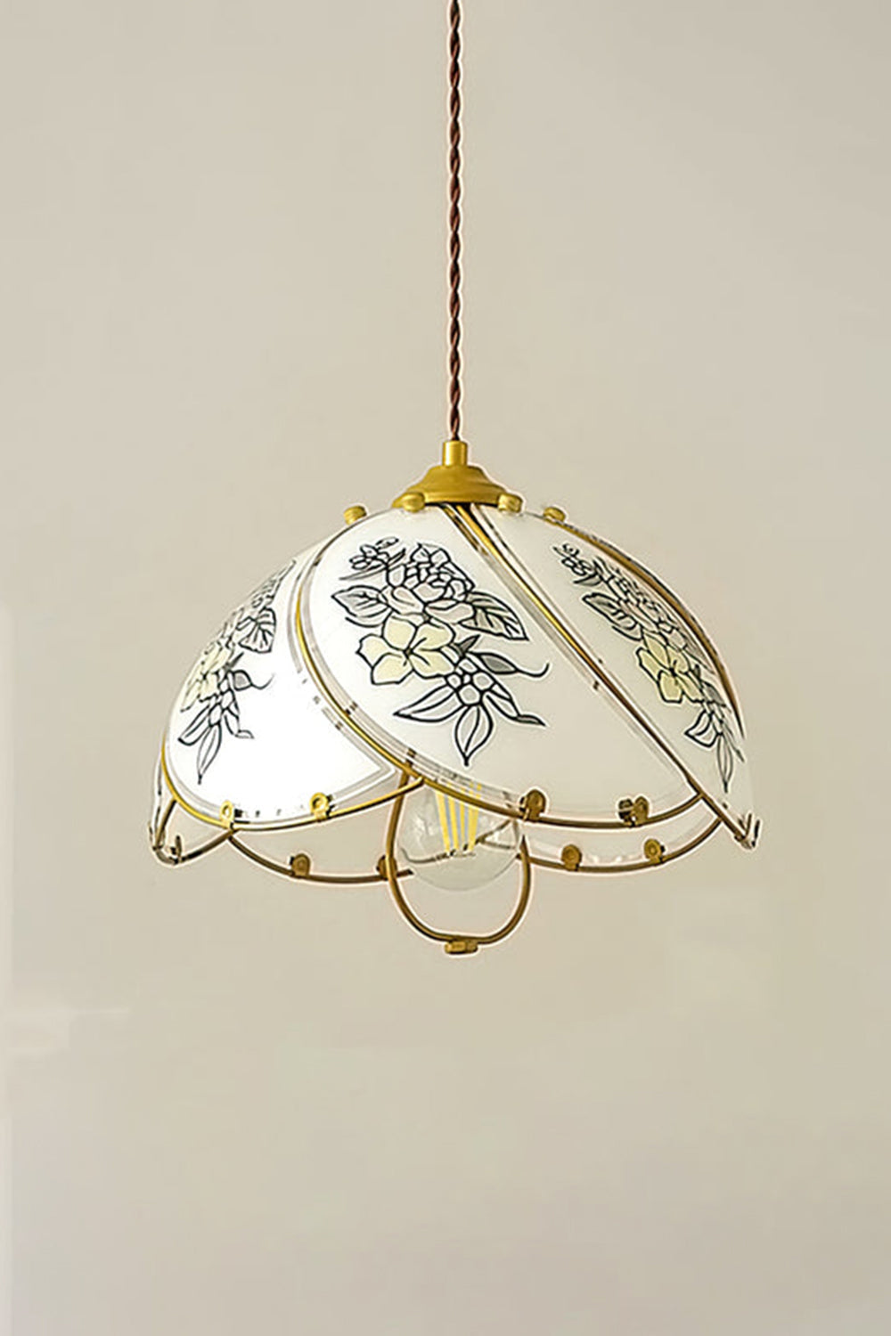 Lillian Retro Floral Pendant Lamp | Glass, Metal | Front view of the fully illuminated floral glass hanging lamp radiating soft ambient light against a neutral studio wall | vexa lamps