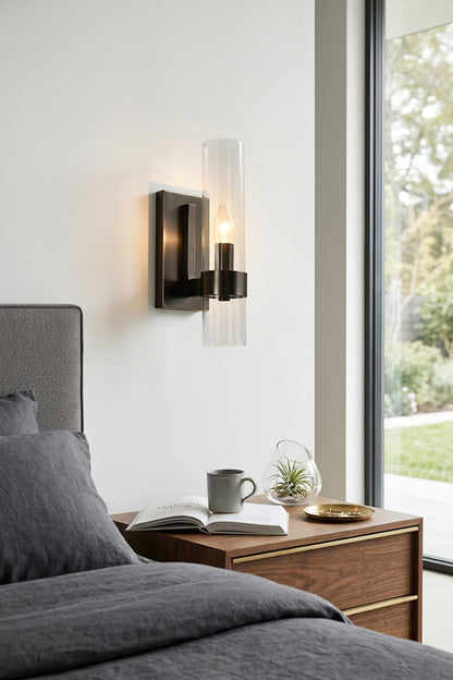 Black linear metallic wall sconce | Brass, Glass | Installed as a bedside reading light | vexa lamps