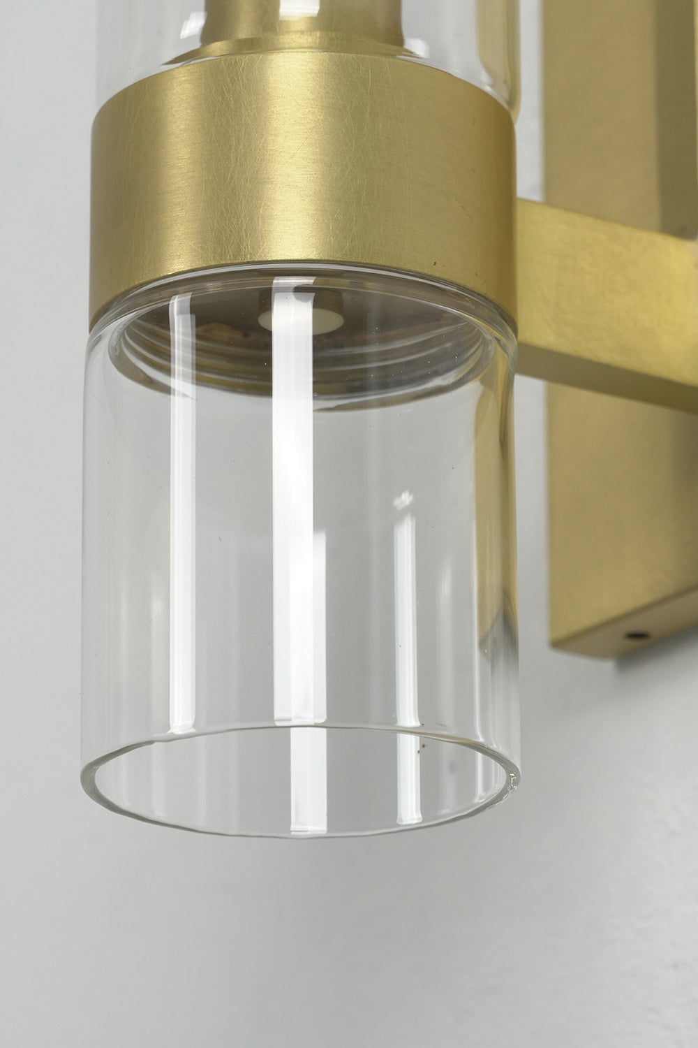 Extreme close-up of the brass ring support | Brass | Showing the polished metal finish and glass connection | vexa lamps