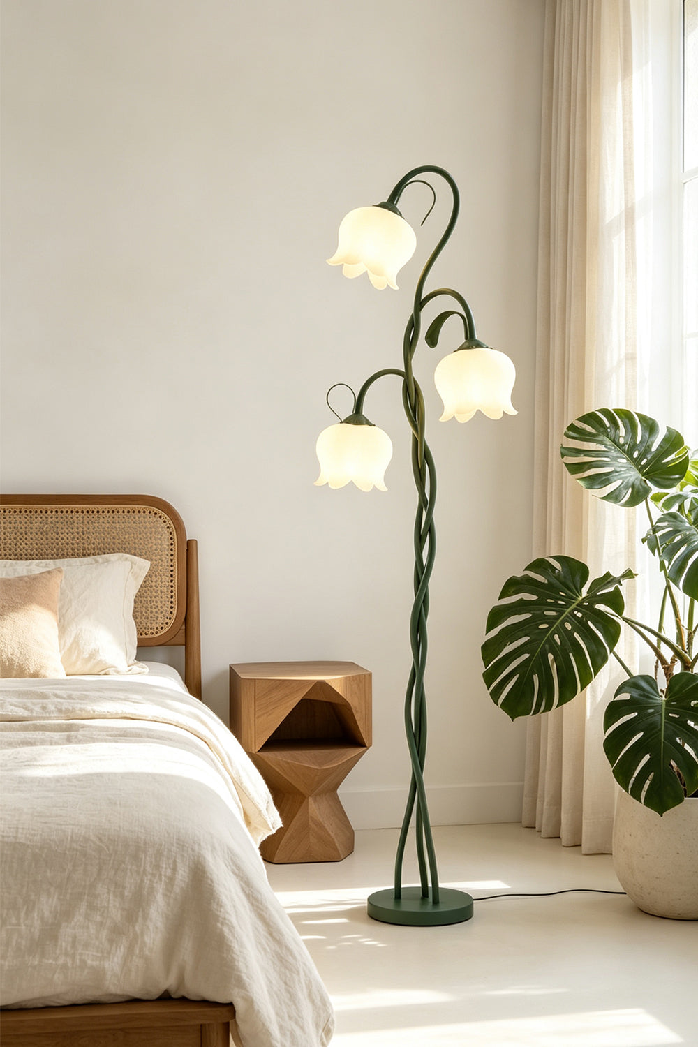 Linnea Tulip Bloom Floor Lamp | Glass and Green Metal | Standing next to a bed and potted plants in a bright bedroom | vexa lamps