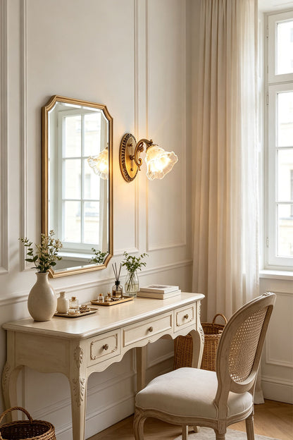 Lisette Blossom Glass Brass Wall Lamp | Glass and Brass | Mounted on a wall near a vintage vanity dressing table and arch mirror | vexa lamps