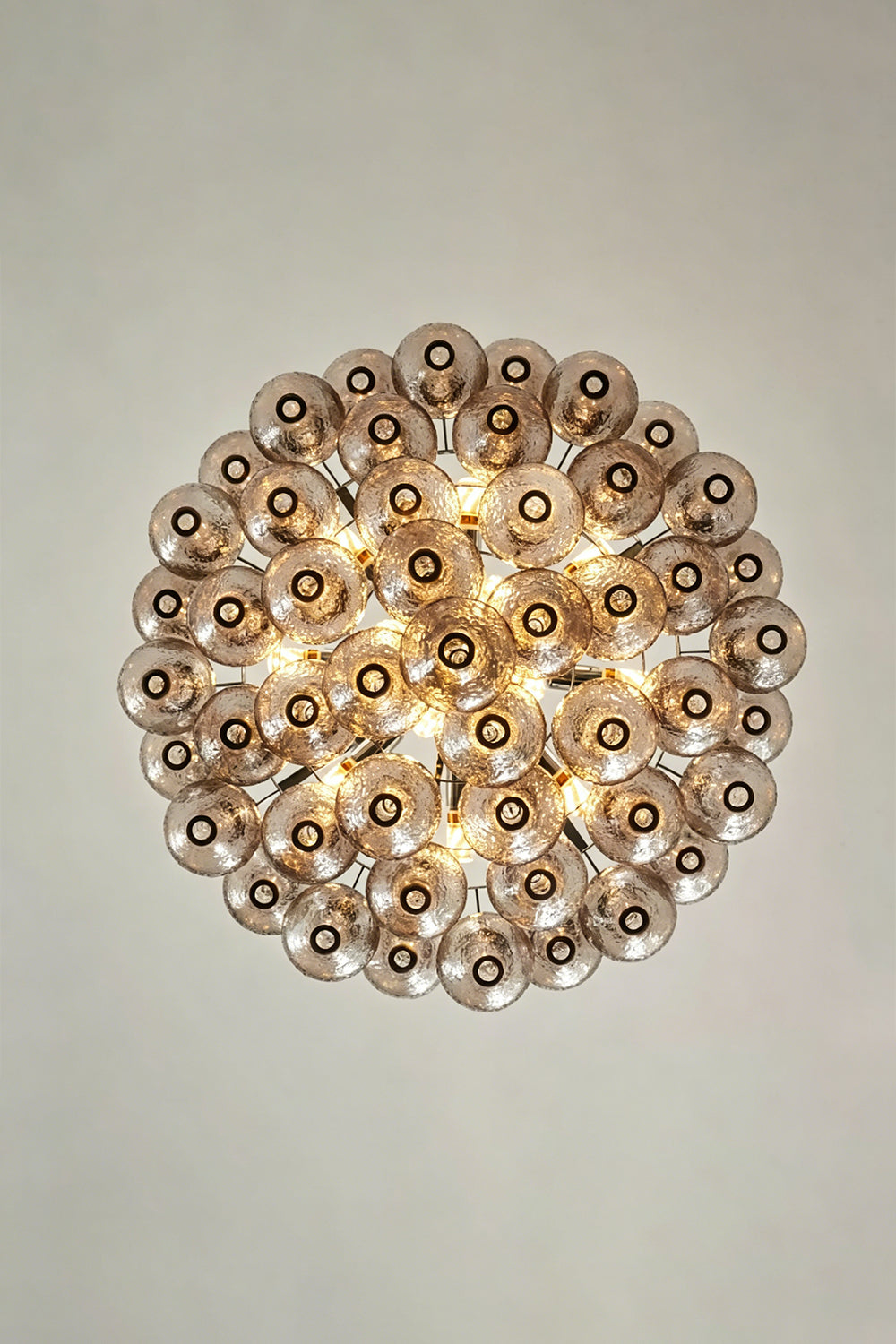 Lucina Tiered Smoked Glass Chandelier showcasing intricate hand-blown glass components with a smoky amber tint.