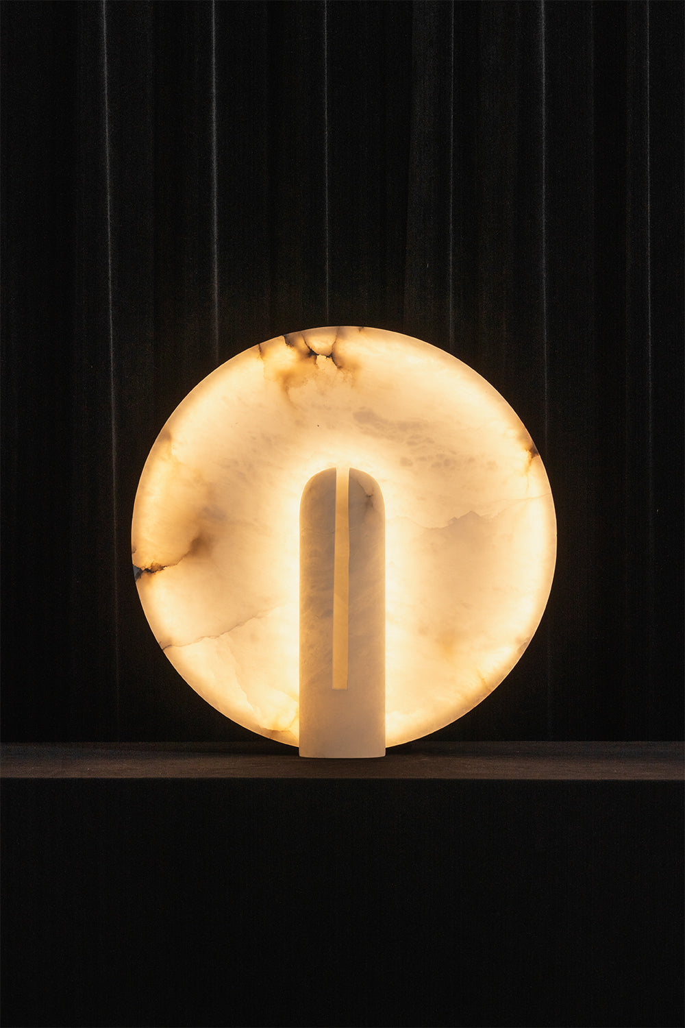 Lunar Horizon Alabaster Table Lamp | Alabaster | Lit product shot against dark background | vexa lamps