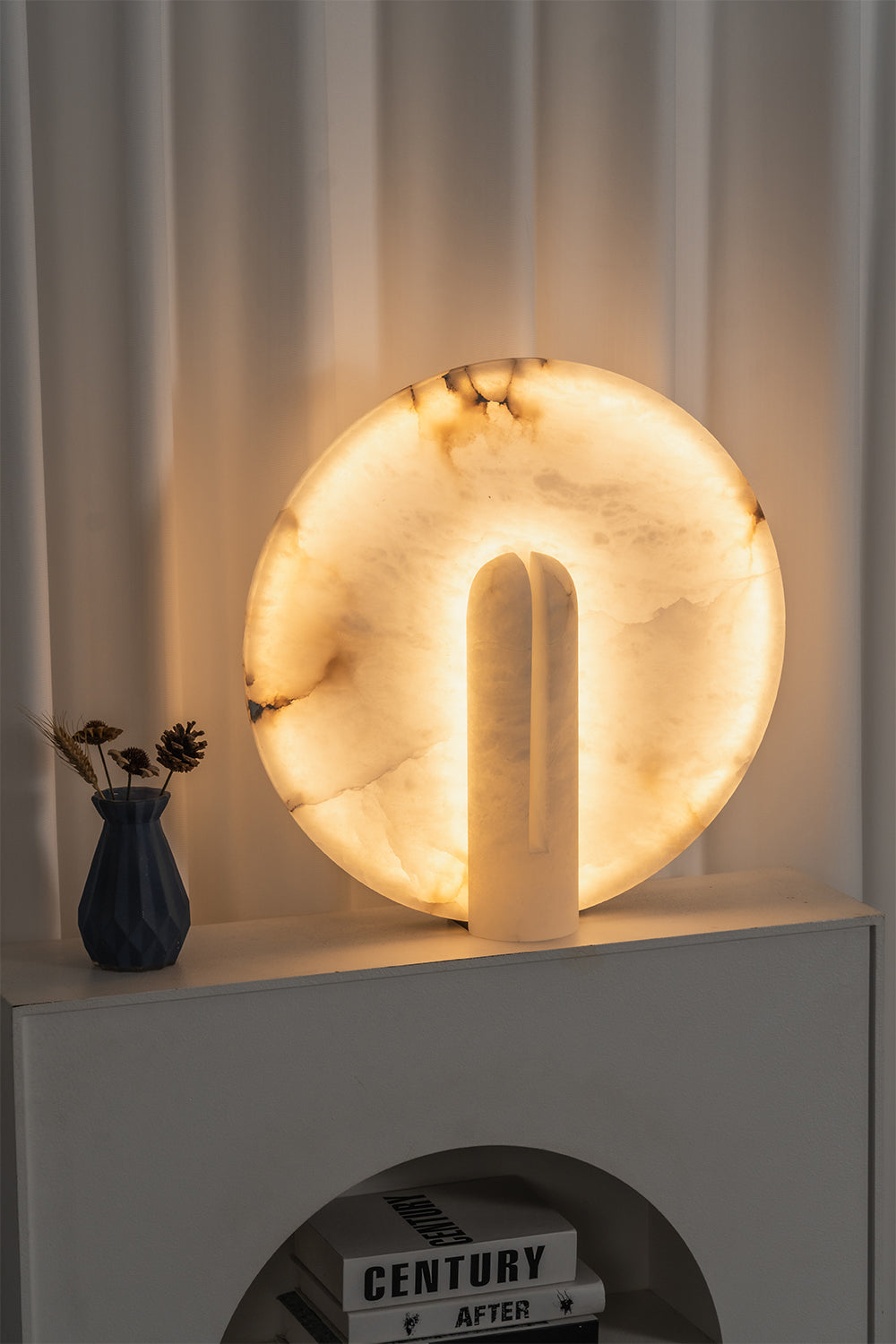 Lunar Horizon Alabaster Table Lamp | Alabaster | Lit view on white shelf in modern interior | vexa lamps